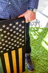man holding thin blue line flag